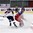 LUCERNE, SWITZERLAND - APRIL 19: Russia's Denis Guryanov #25 attempts a hip check against Slovakia's Samuel Solensky #25 during preliminary round action at the 2015 IIHF Ice Hockey U18 World Championship. (Photo by Matt Zambonin/HHOF-IIHF Images)